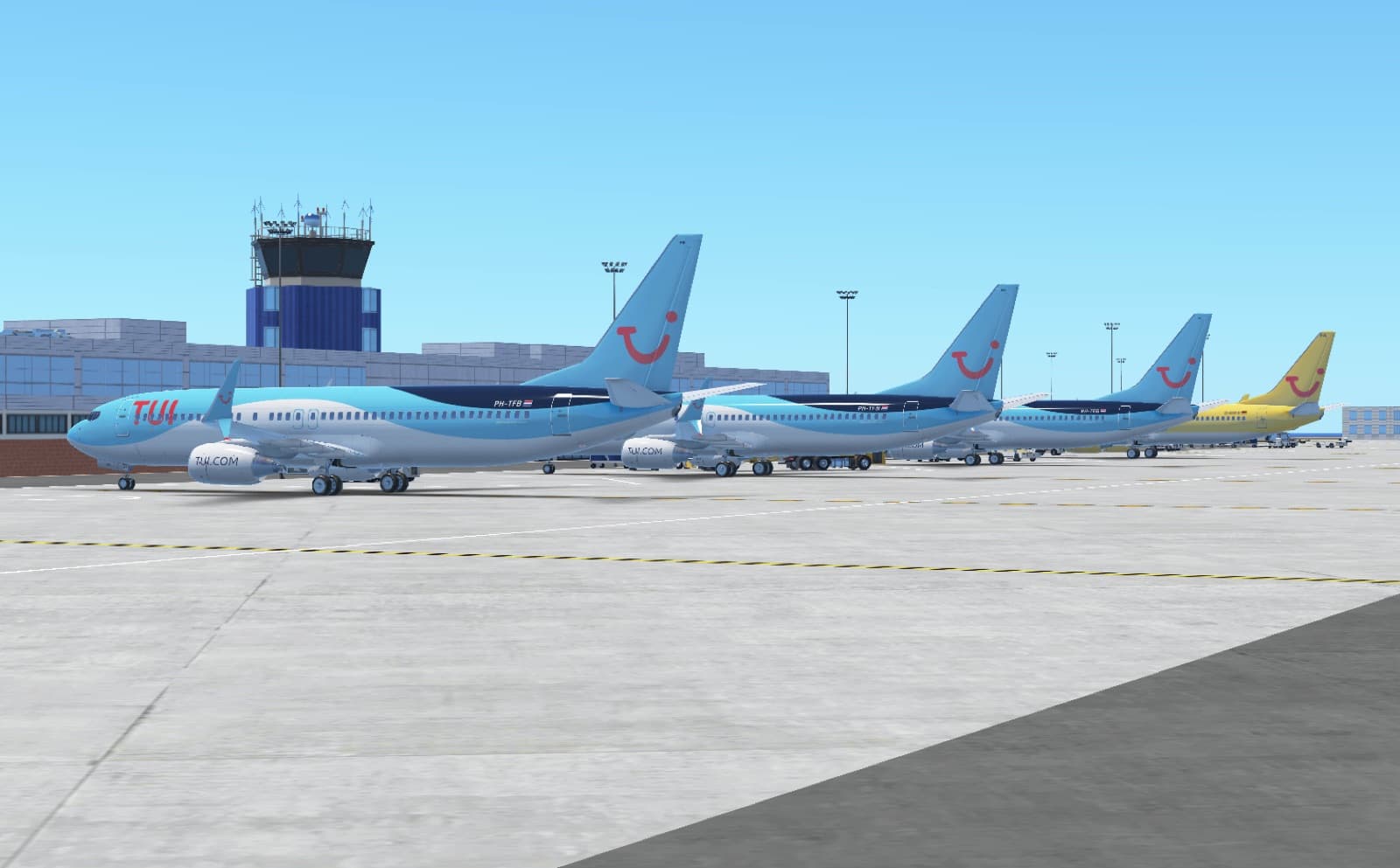 TUI Boeing 737s parked at an airport terminal